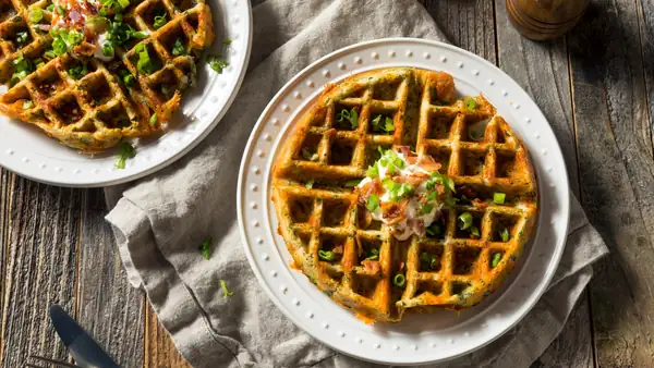 Homemade savory waffles with bacon and green onions