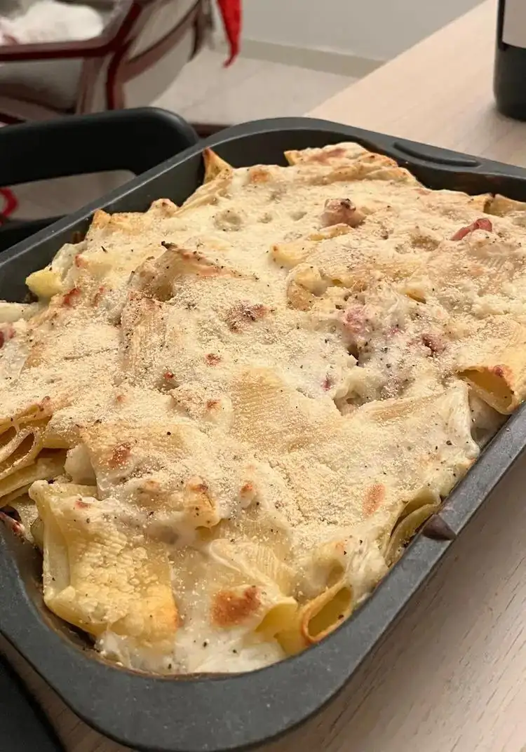 Baked pasta with cauliflower, fontina cheese, and ham