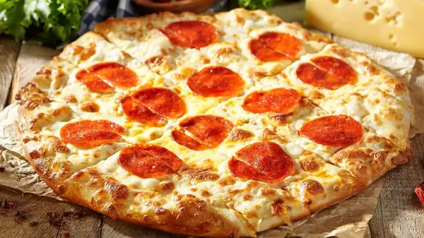 Why It's A Mistake To Roll Out Your Pizza Dough