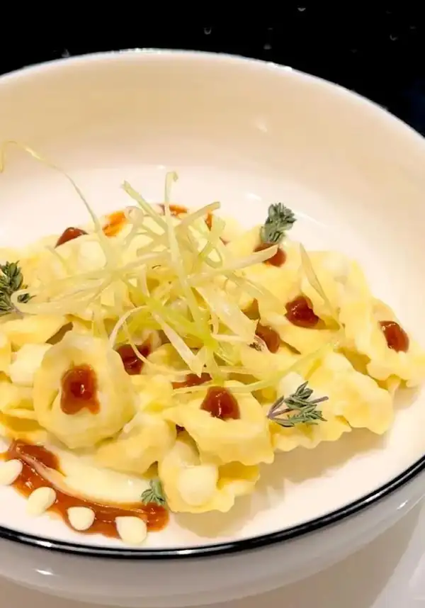 Fine meat tortellini, potato cream, brown stock and fried leek