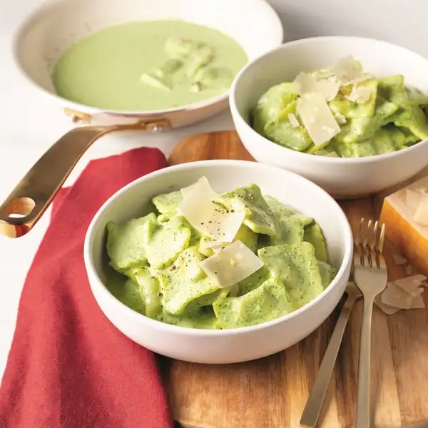 Beef ravioli with spinach sauce