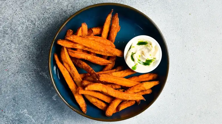 Why It Pays To Soak Sweet Potato Fries Before Baking