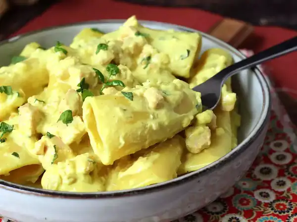 Paccheri pasta with creamy salmon and saffron sauce