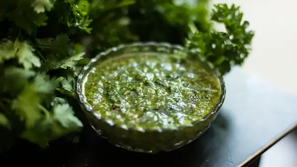 That Zesty, Herb-Packed Sauce You Love Also Doubles As A Marinade