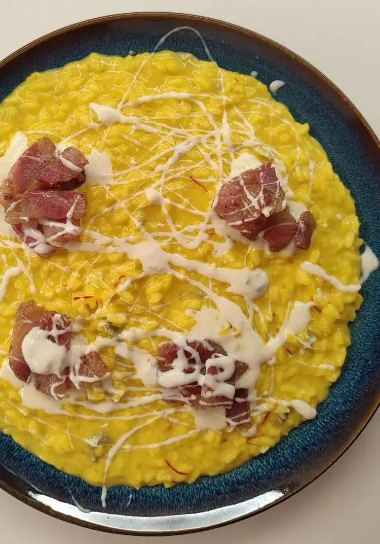 Saffron risotto with crispy bacon and gorgonzola sour cream