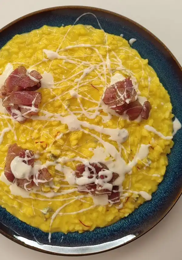 Saffron risotto with crispy bacon and gorgonzola sour cream