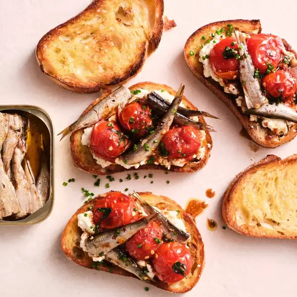 Smoked sardines on toast with ricotta & tomato