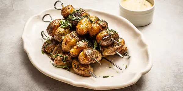 Barbecued potato skewers with basil mayo