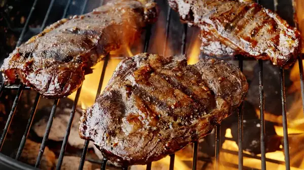 Why You Should Never Put Meat On The Grill Straight From The Fridge
