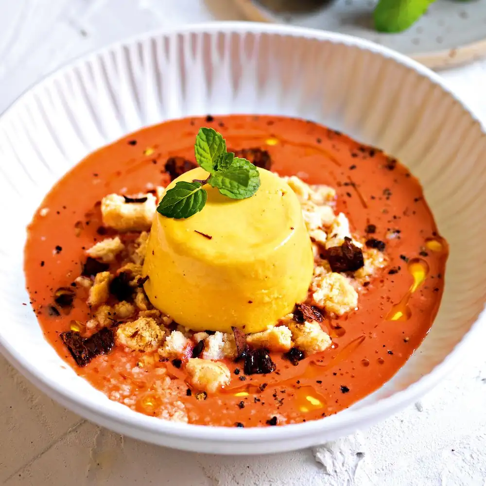 Yellow pepper mousse on cherry tomato cream