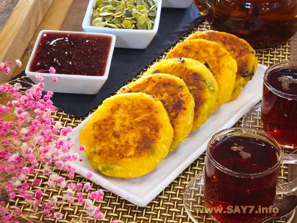 Syrniki with pumpkin and dried cranberries