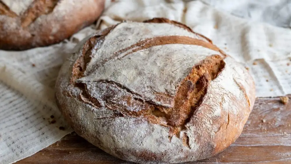 Why did people kiss bread before eating it or throwing it away?