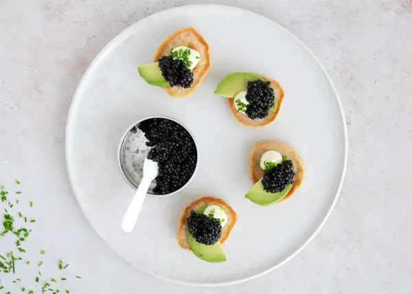 Blinis with caviar and avocado