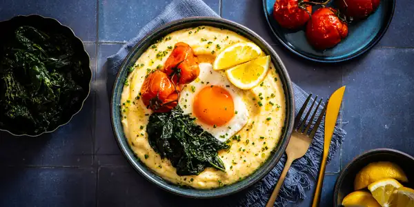 Cheesy Eggs And Grits With Cavolo Nero And Roasted Tomatoes Recipe
