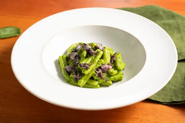 Pasta with baby squid and spinach pesto