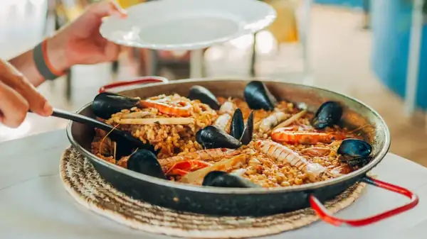 The Easy Shortcut To Get Paella On The Table Faster