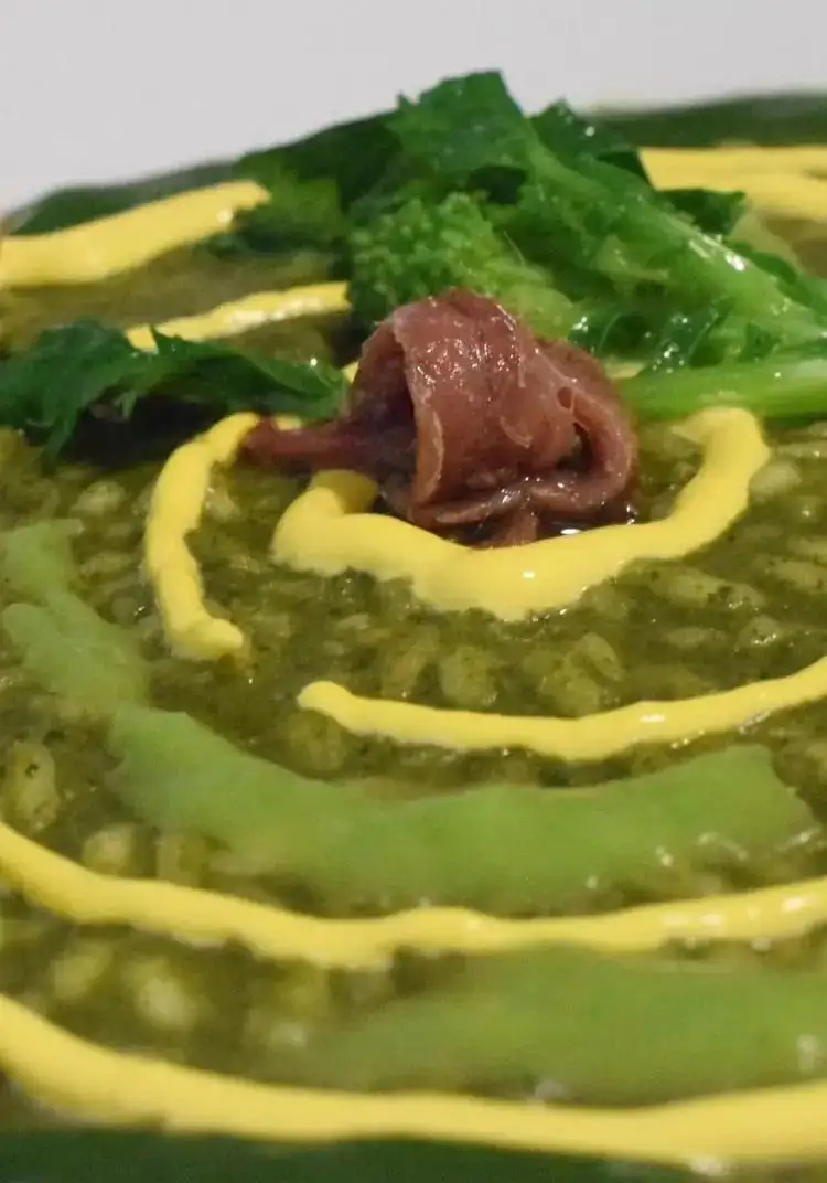 Risotto with turnip tops and saffron sauce