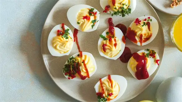Amp Up Your Deviled Eggs With A Sweet And Saucy Ingredient