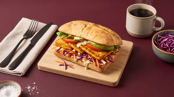 Colorful sandwich with crispy tofu and fresh red cabbage salad