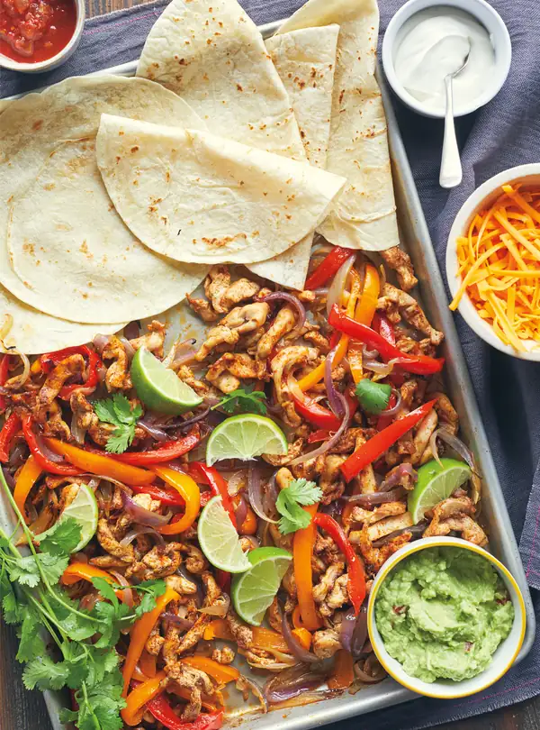 Chicken fajitas cooked on a griddle