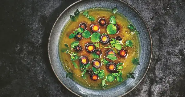 Charcoal-Roasted Carrots with Lovage Broth