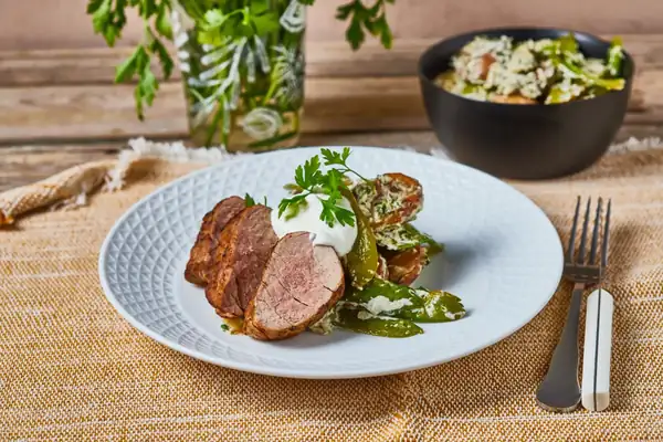 Pork tenderloin with sugar snap peas and new potato salad