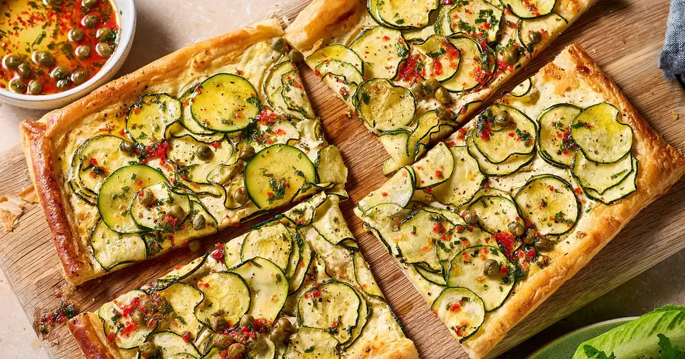 Courgette & feta tart with caper & mint dressing