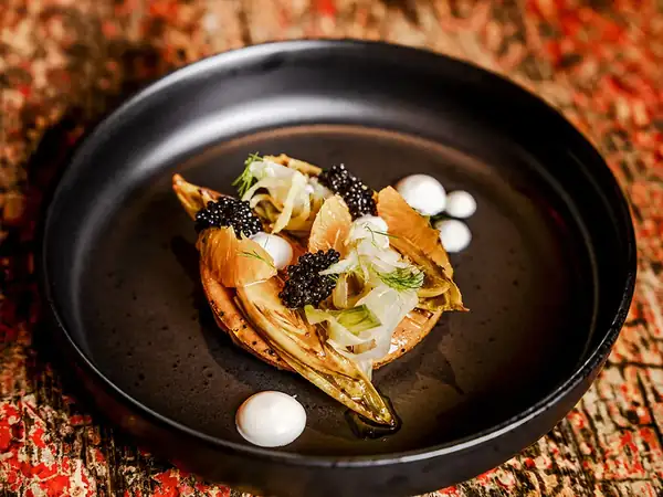 Potato tart with glazed chicory and caviar