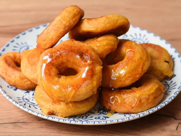 Peruvian picarones, traditional recipe of the classic fried sweet bathed in honey