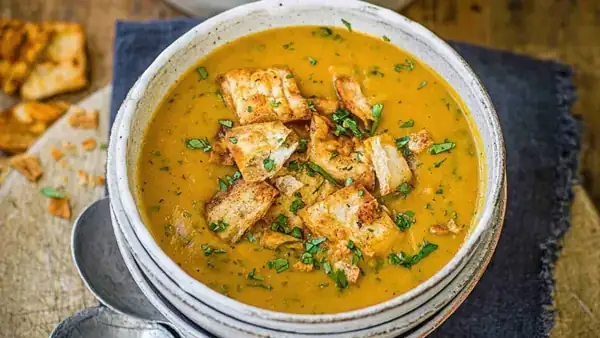 Carrot soup with coriander & spicy pita croutons