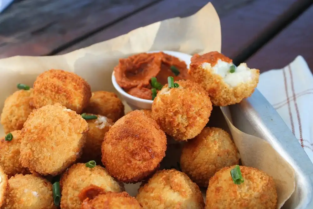 Enjoy some crispy Parmesan cheese fritters