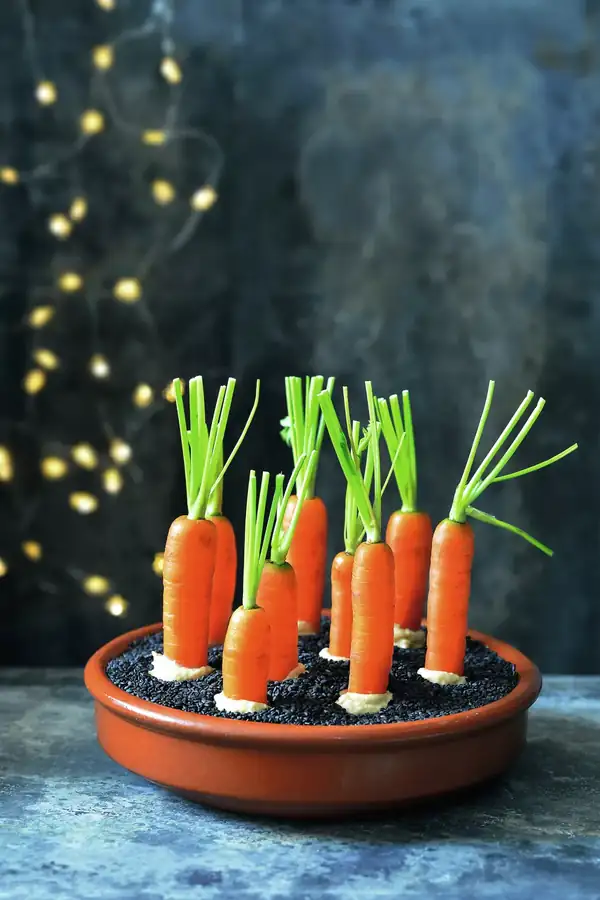 Young carrots with hummus and sesame