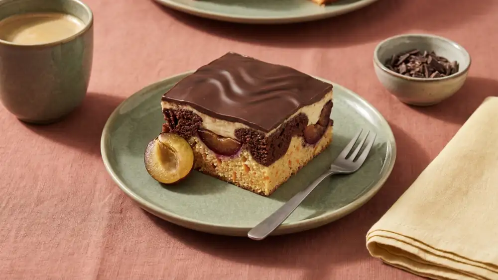Autumnal plum Danube wave cake with fine vanilla cream and chocolate glaze