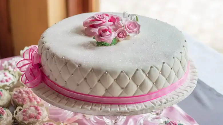 The Reason Fondant Frosting Is So Popular For Wedding Cakes