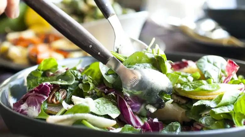Give Your Bowl Of Greens A Better Crunch With One Unexpected Ingredient