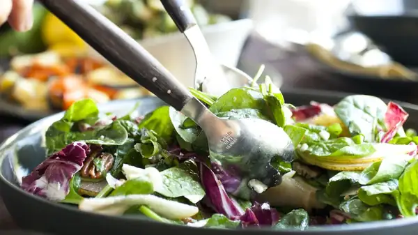 Give Your Bowl Of Greens A Better Crunch With One Unexpected Ingredient