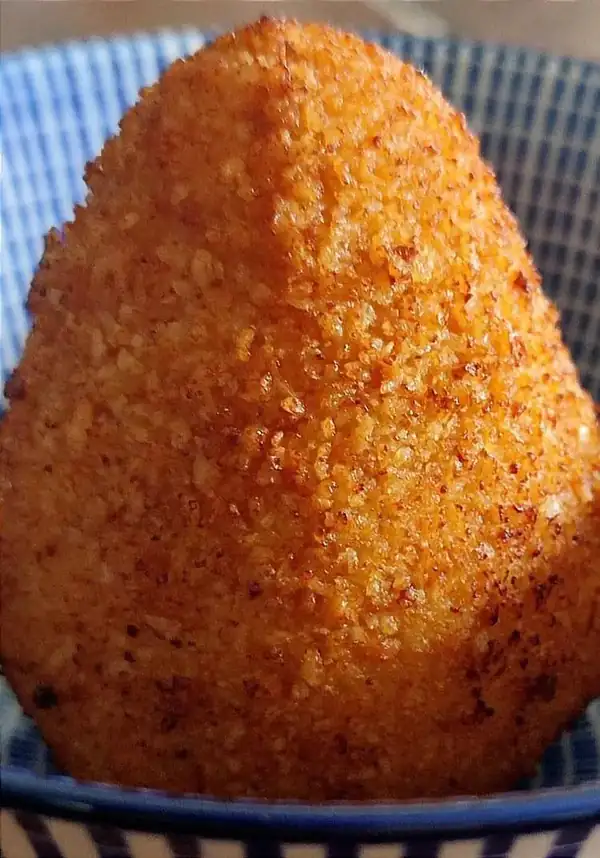 Arancini with saffron risotto and a soft Montasio cheese center