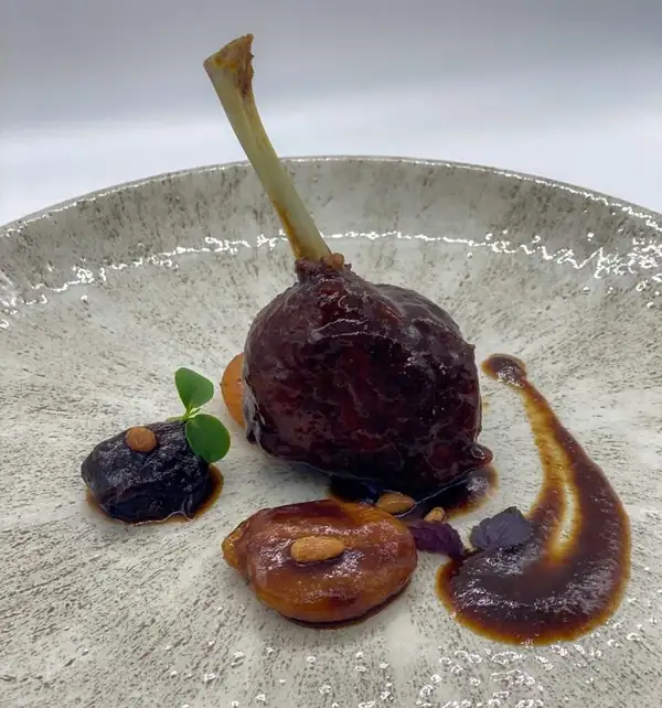Roast duck with prunes and raisins