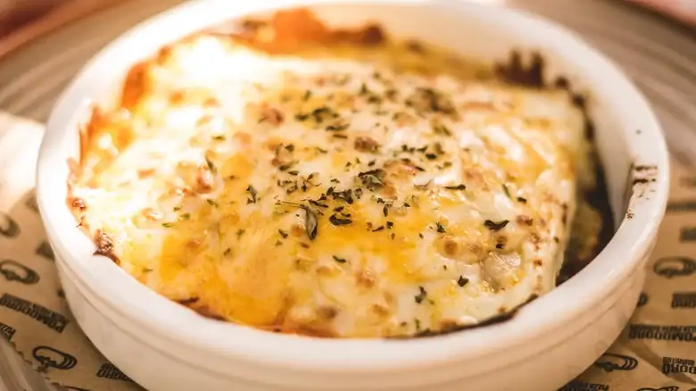 One Of Italy's Most Traditional Lasagnas Is Made With Tiny Meatballs (And No Tomato Sauce)