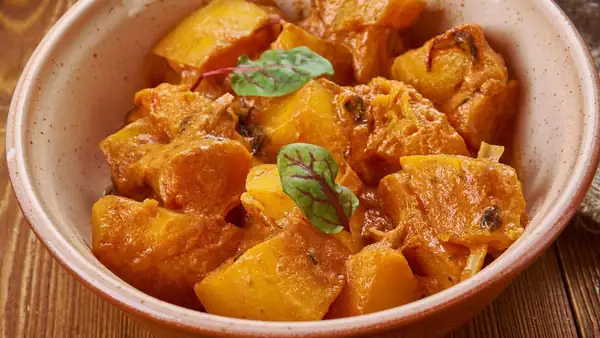 This pumpkin curry with coconut milk, ginger and herbs warms you from the inside out