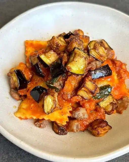FINE RAVIOLI WITH DATTERINO TOMATO SAUCE, AUBERGINES AND SAUSAGE