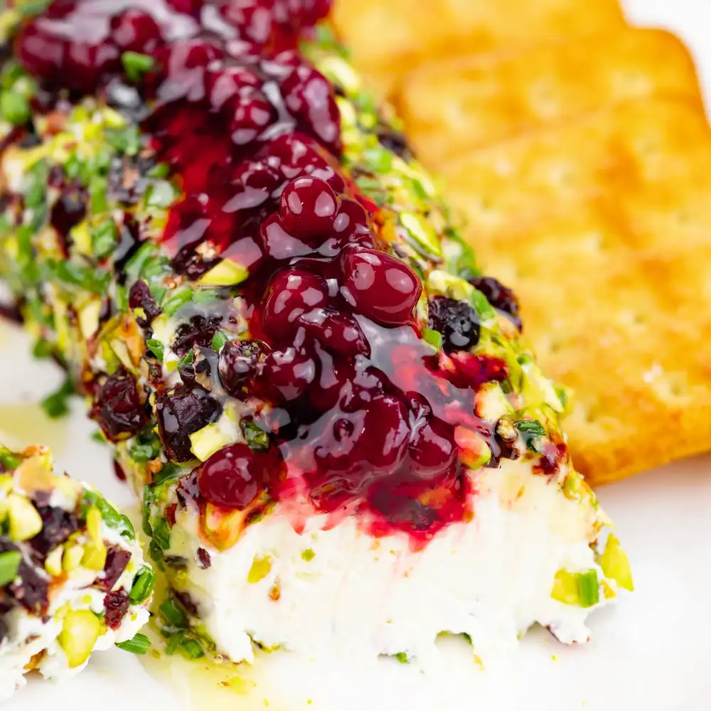 Cheese roll with cranberries and pistachios