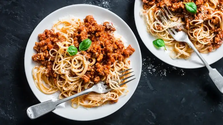 Leftover Parmesan Rinds Are The Key To An Umami-Filled Vegetarian Bolognese