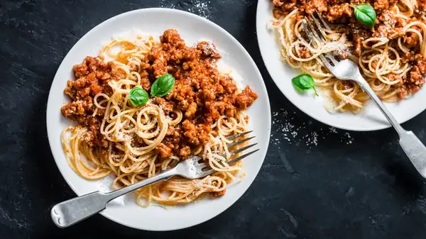 Leftover Parmesan Rinds Are The Key To An Umami-Filled Vegetarian Bolognese