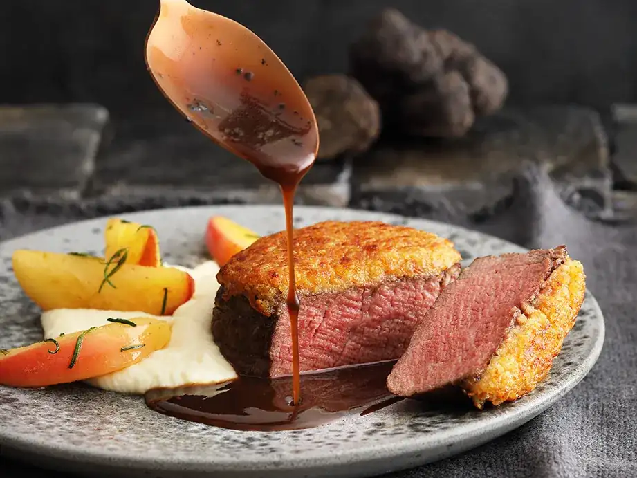 Filet steaks with brioche crust, celery cream and truffle sauce