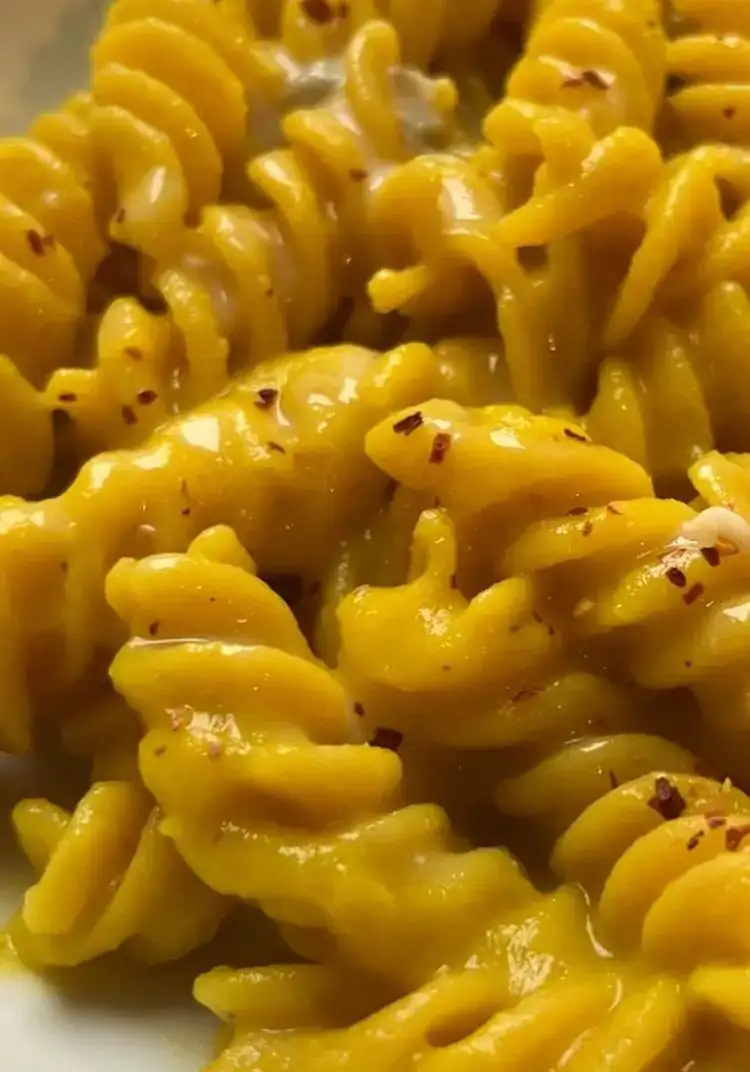 Chickpea fusilli with yellow cauliflower cream, saffron, potatoes, and gorgonzola cream