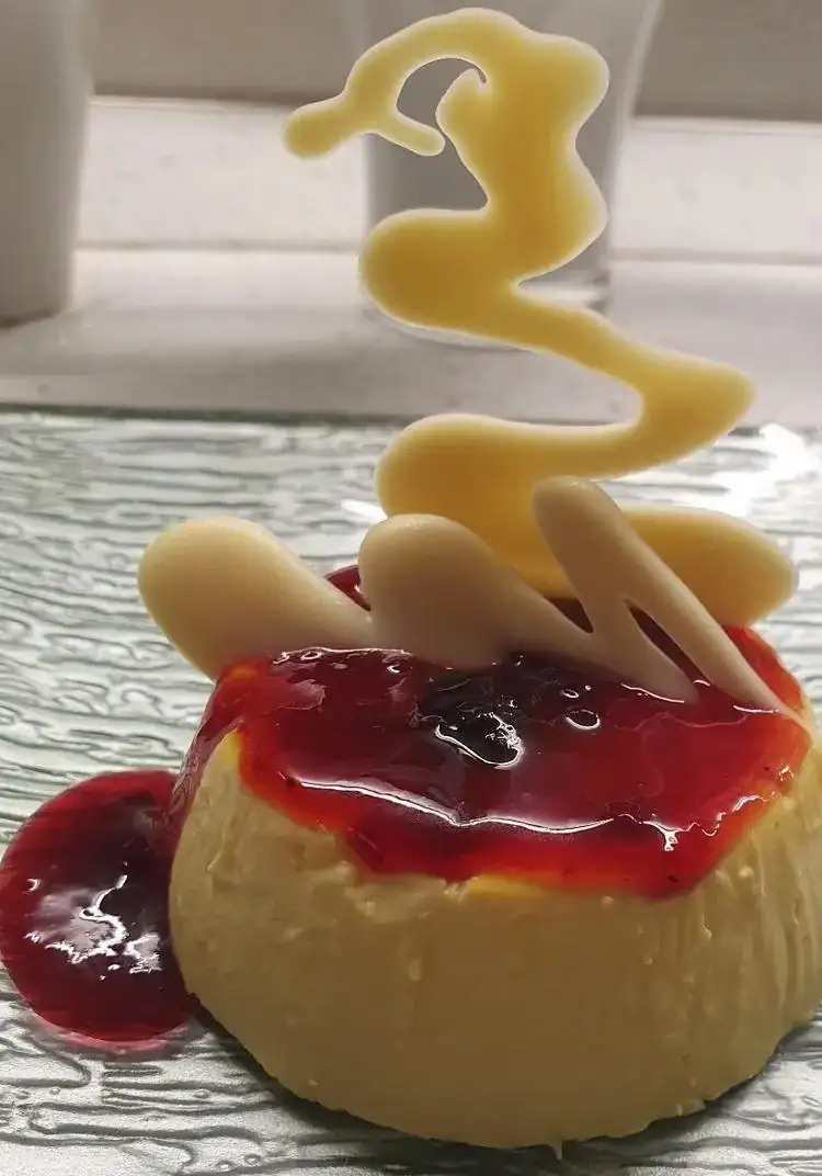 Saffron panna cotta with jam and white chocolate