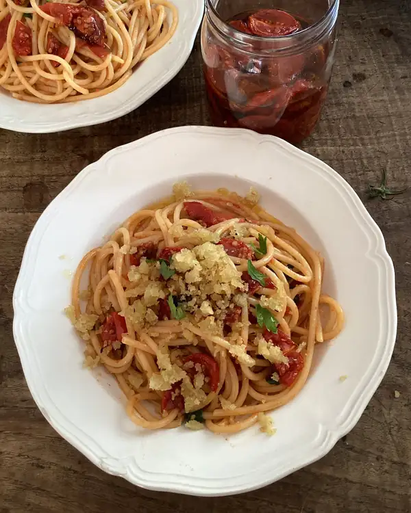 Rachel Roddy’s recipe for spaghetti with semi-dried tomatoes, garlic, herbs and breadcrumbs