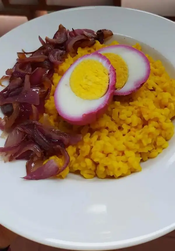 Saffron rice, Tropea onion, and pink eggs