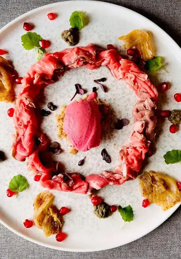 Angus roast beef, raspberry sorbet, crumbled Gruyere biscuits and sweet and sour onion